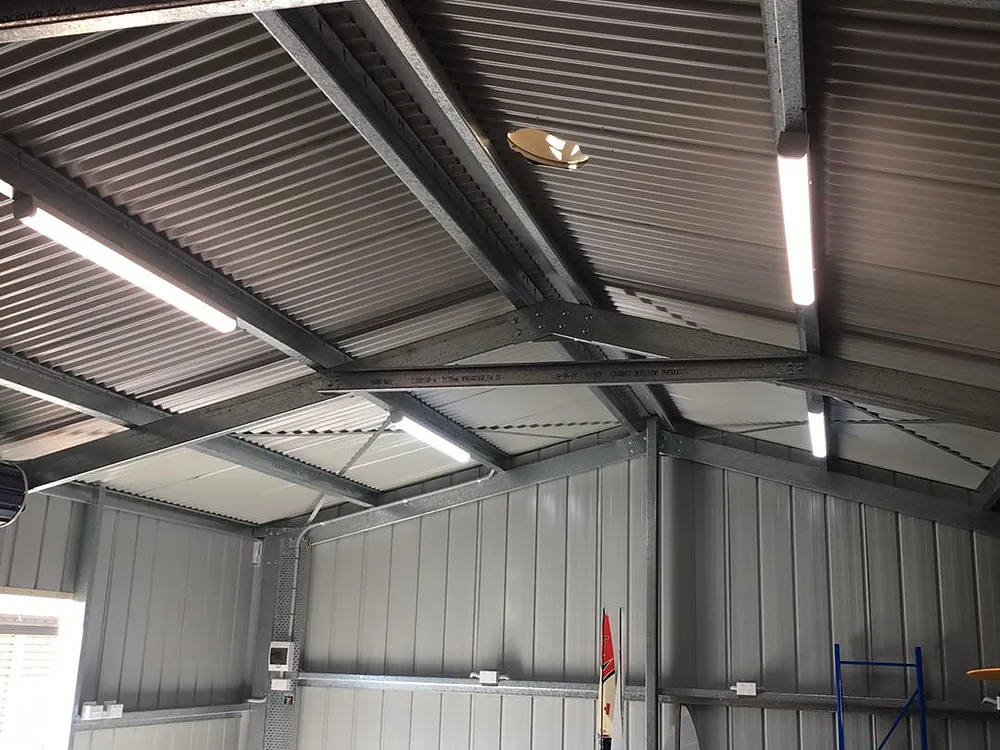 Steel shed wired with LED batten lights and a sub board