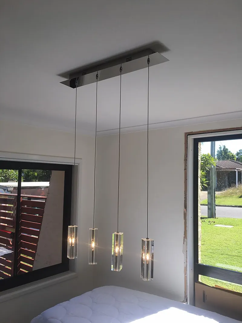 Glass pendant lights hanging in a bedroom